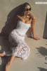 A woman wears a structured corset-style bodice and a lace wedding skirt_XS_