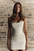 A woman wears a structured corset-style bodice and a short wedding skirt_XS_