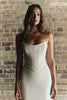 A woman wears a structured corset-style bodice_XS_