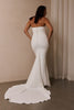 A woman wearing a strapless white mermaid style gown_L_
