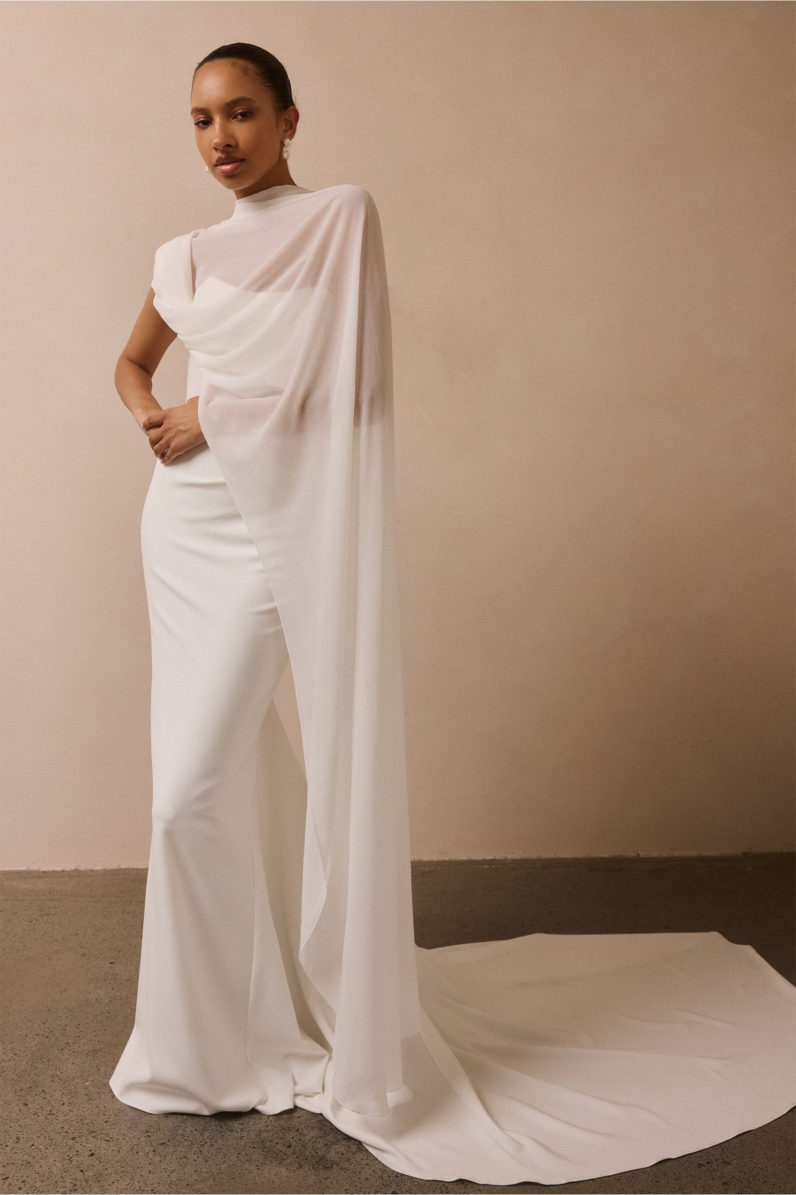 A woman wearing a strapless white mermaid style gown_XS_