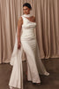 Woman wearing a white off-shoulder gown with a cape