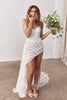 Woman in a strapless lace wedding dress holding a bouquet_XS_