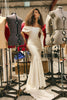 Woman in an off-shoulder wedding dress standing is our design house_XS_