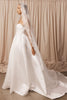 Bride wearing a lace mantilla veil and wedding dress