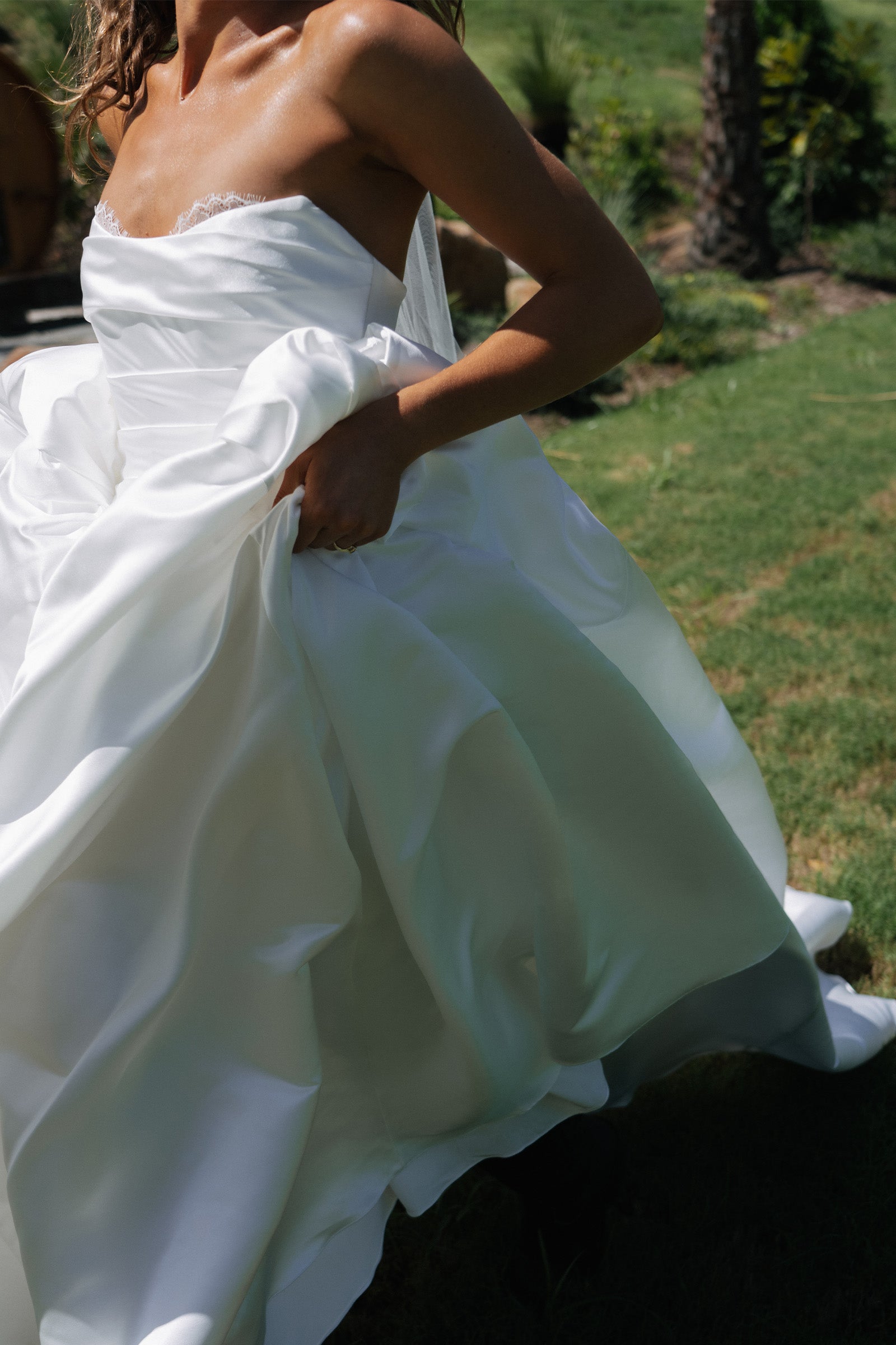 Woman wearing a satin A-line wedding dress_XS_