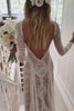 Woman wearing a long sleeve boho wedding dress.