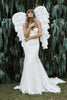 Bride wearing Filamena dress with wings